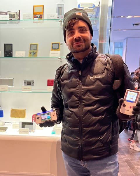 Kris in a beanie and black puffer jacket in a Nintendo store.