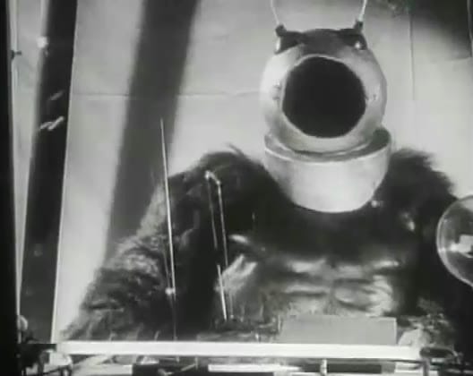 The Ro-Man from Robot Monster, a man in a gorilla suit and a diving helmet, at his control console.