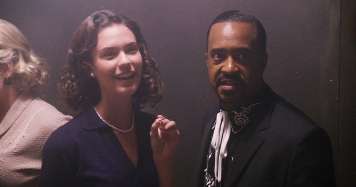Sam the drummer, played by Tim Meadows, stares into the camera in a smoky back room in Walk Hard.
