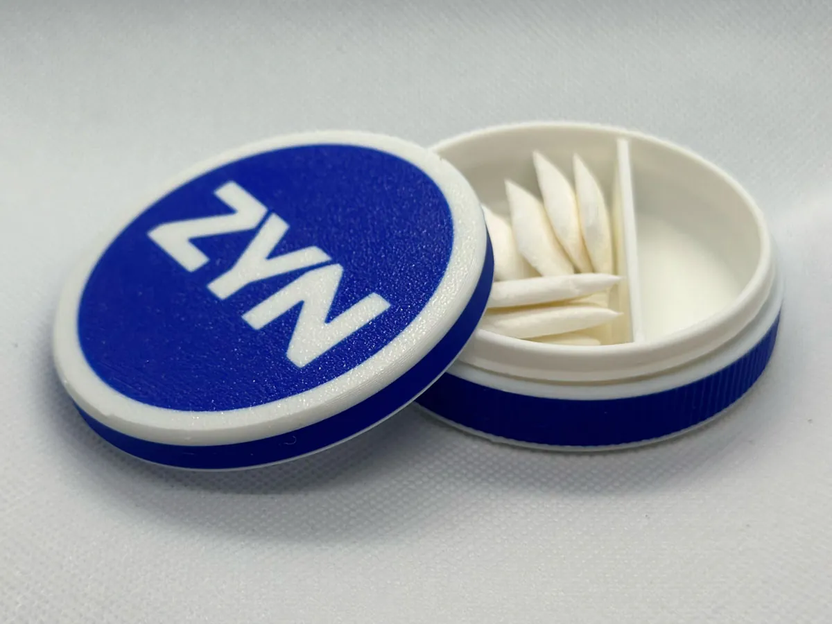 The threaded Zyn can printed in blue and white, open